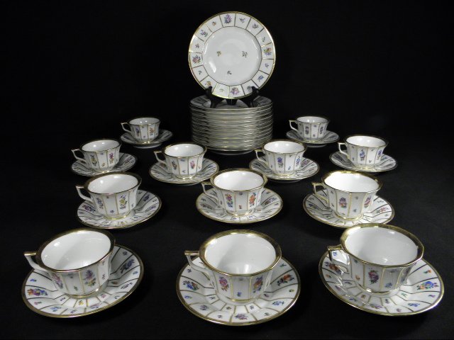 ROYAL COPENHAGEN "HENRIETTE" DESSERT SERVICE FOR T: Royal Copenhagen floral decorated porcelain dinnerware group in the "Henriette" pattern. Lot consists of (12) 2.2" tall cups, (12) 5.3" diameter saucers, and (12) 7.6" diameter plates. All pieces are 