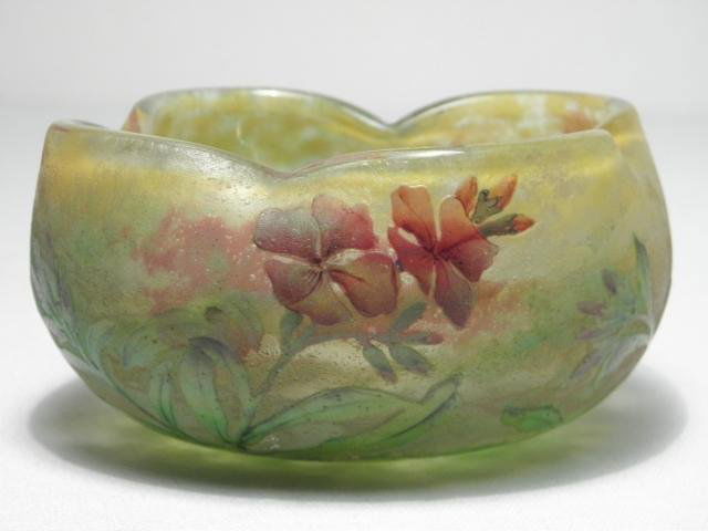 DAUM NANCY FLORAL CAMEO GLASS BOWL: An early Daum Nancy floral cameo glass bowl. Pinched free-form design, decorated with cameo etched glass florals around the outside. Signed "Daum Nancy" with the Cross of Lorraine on the side. Conditi