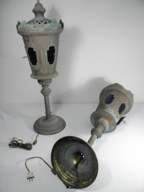 PAIR COPPER & COLORED GLASS POST MOUNT LANTERNS: Pair early copper and colored glass post mount lanterns. Converted to electric, and with a circular base for tabletop use. Each lantern has five windows, each with a different colored curved glass pan