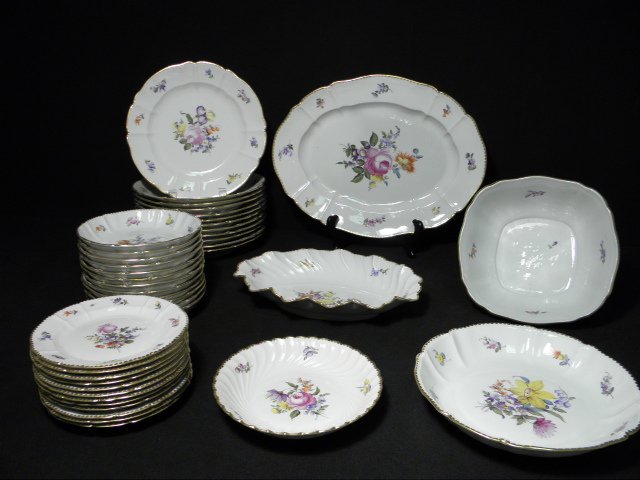 NYMPHENBURG PORCELAIN DINNERWARE SERVICE FOR TWELV: A Nymphenburg German porcelain dinnerware service for twelve consisting of (12) 9.65" dinner plates, (12) 6.4" plates, (12) 6.75" bowls, (1) 9" bowl, (1) 8.25" wide square serving bowl, (1) 15.25" ser