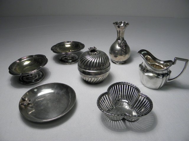 ASSORTED CONTINENTAL SILVER TABLEWARES: 7 PCS - 14: Lot of assorted continental silver tablewares. Includes a 4" tall bud vase (stamped "900 AK"), a small .800 silver creamer (stamped with German marks and "800"), a small 2.9" tall circular lidded box 