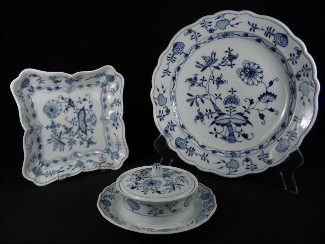 MEISSEN & OTHER "BLUE ONION" PORCELAIN DINNERWARE: Lot of assorted porcelain dinnerware in the German "Blue Onion" pattern. Includes a Meissen 6.75" wide covered butter dish (marked with crossed swords on base), a Meissen 8.5" wide square server (mark