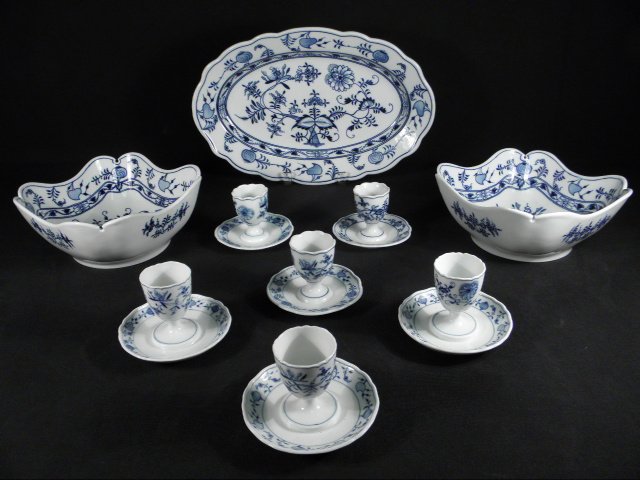 MEISSEN & OTHER "BLUE ONION" PORCELAIN DINNERWARE:: Lot of assorted Meissen and other German "Blue Onion" pattern porcelain dinnerware. Includes (3) 3" tall Meissen egg cups (all have triple cancellation slash marks), (3) 2.9" tall egg cups by C. Teich