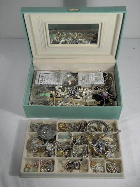 ASSORTED LADIES COSTUME JEWELRY: Lot of assorted ladies costume jewelry. Includes rings, pendants, watches, bracelets, earrings, necklaces and much more, by makers such as Avon, Monet, Waterford, Alpaca, etc. Most pieces are gold ton