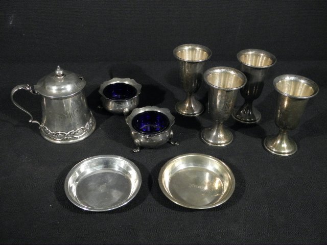 STERLING SILVER TABLEWARES: 5.6+ TROY: Lot of assorted sterling silver tablewares. Includes a pair of English sterling silver salt cellars with cobalt glass inserts, a Shreve Grump & Low Co. sterling honey/mustard cellar, a pair of Sterlin