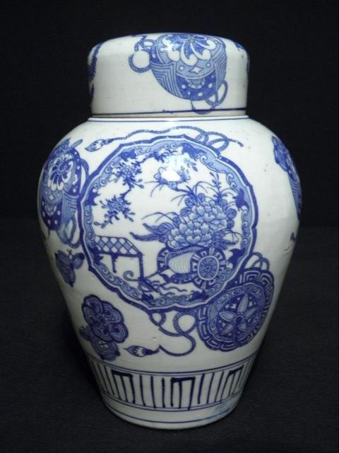 EARLY CHINESE EXPORT BLUE WHITE PORCELAIN JAR: Early Chinese Export blue and white lidded ginger jar. Decorated with landscape scene in medallions on sides and lid. Unmarked. Condition: hairline crack running from rim down about 2", minor discolor