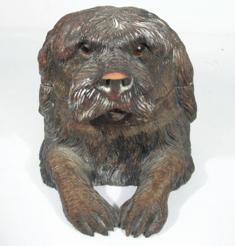 BLACK FOREST CARVED WALNUT DOG-FORM HUMIDOR: Black forest carved Walnut dog-form humidor. Glass eyes, with a polished Walnut interior and two metal hinges. Unique signature carved into base, and base of the lid. Condition: very small loss to woo