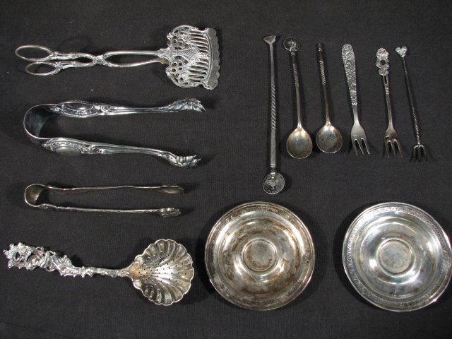 CONTINENTAL SILVER UTENSILS & TABLEWARES - 7.33 TR: Lot of assorted continental silver utensils and tablewares. Includes (2) 3.25" diameter butter pats/dishes (stamped "800 AK"), a pair of pierced silver tongs (stamped on handle "800"), a heavy pair of