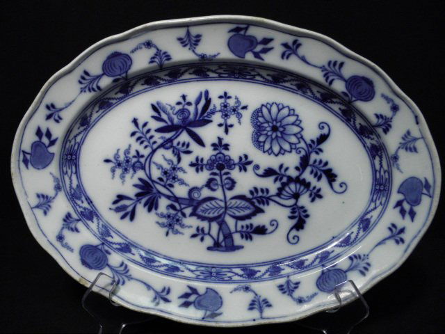 ENGLISH "MEISSEN BLUE ONION" STONEWARE PLATTER: An early 20th century English flow blue stoneware platter in the Meissen "Blue Onion" pattern. Marked on base with "Meissen England" in a circle, below a crown. Condition: scratches and wear to glaze,
