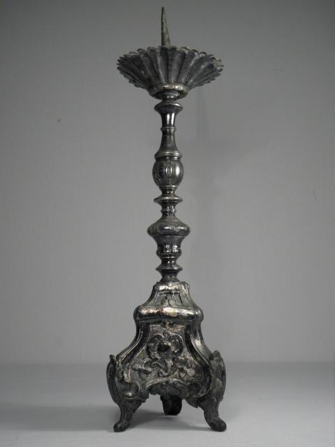 19TH C EMBOSSED & SILVERED METAL ALTAR CANDLESTICK: A 19th century altar candlestick with a heavily embossed metal design. Silver finish, actual silver content unknown. Condition: heavy tarnishing and dings/dents, some losses/bends, see images. Measure