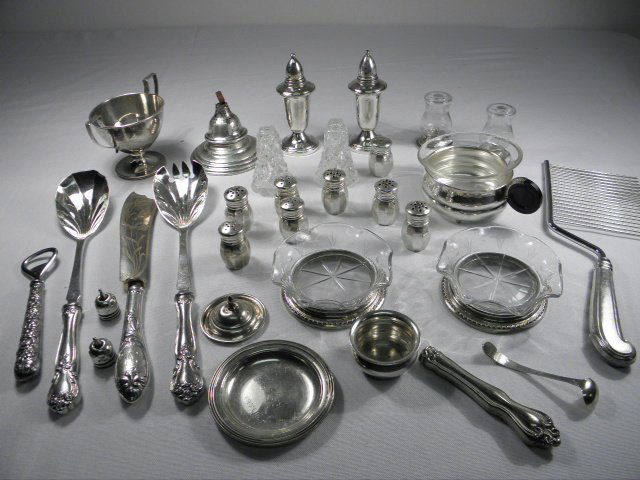 ESTATE LOT ASSORTED STERLING SILVER: Group lot of assorted sterling silver items. Includes two etched glass coasters, each with a sterling silver base; a sterling cup with glass insert and black lacquered handle; a sterling mini trophy c