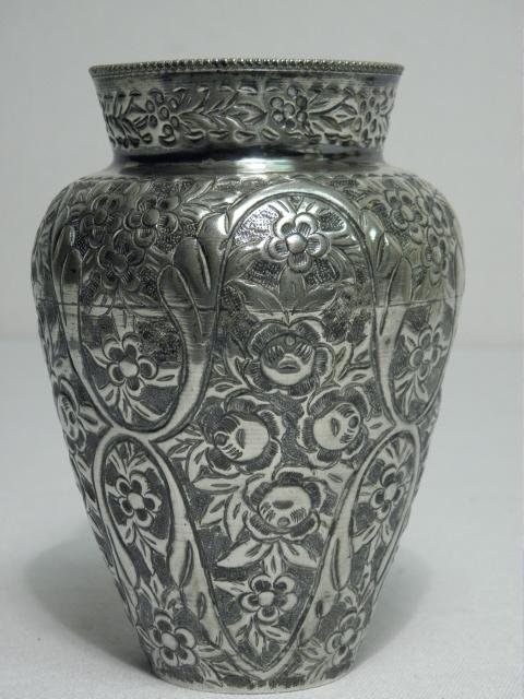 MIDDLE EASTERN EMBOSSED SILVER VASE - 7.45 TROY: A Middle eastern floral embossed silver vase, stamped on base "S800". Condition: good, minor tarnishing, small dents to base, see images. Measures 5.65" tall x 3,85" wide. Total weight: 232 grams or 7