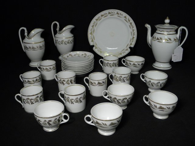 OLD PARIS GILT PORCELAIN DINNERWARE:26 PCS: Lot of Old Paris gilt porcelain dinnerware. Includes (1) 9.2" plate, (8) 5" saucers (2 with chips, 3 with heavy hairlines), (8) 3.25" wide (to handle) cups (two with hairlines), (6) 3.75" wide (to han