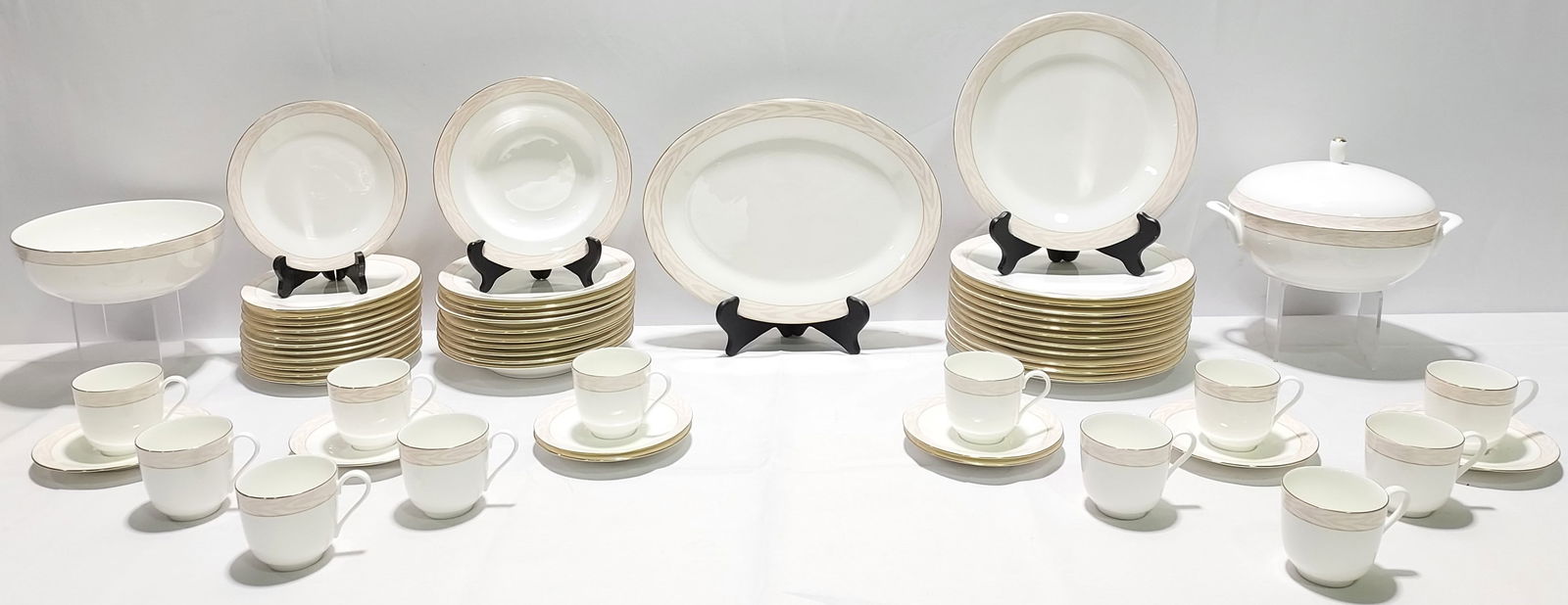 LARGE GROUP MIKASA BONE CHINA SILK MOIRE: Set of Mikasa Bone China, Silk Moire pattern. Includes: 12- Dinner Plates 11.75" dia., 12-Salad Plates 7.75" dia., 11 Soup Bowls 8.75" dia., 8 Saucers 6.25" dia.,12 Tea/Coffee Cups, 1 Oval Serving Pla