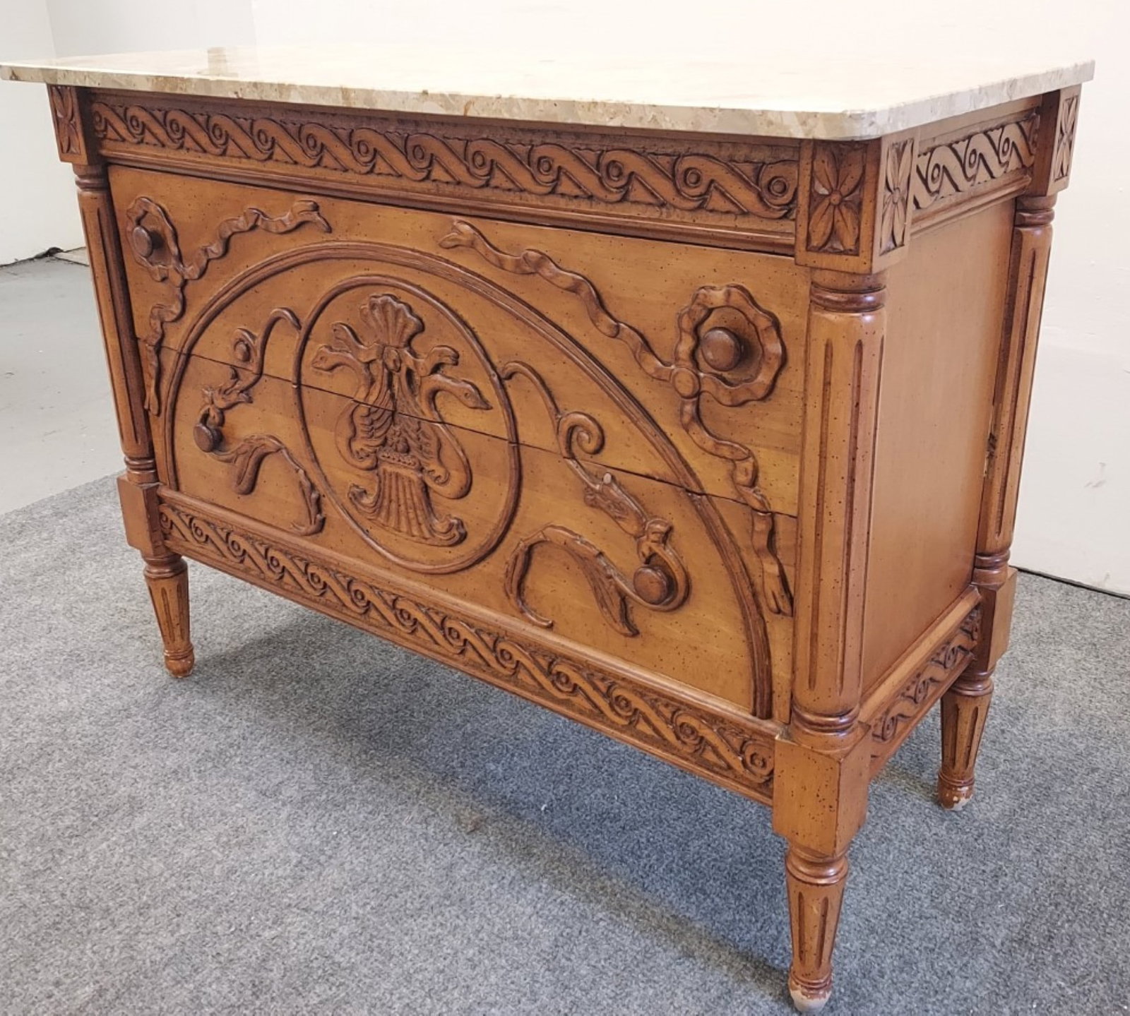 VINTAGE NEOCLASSICAL STYLE MARBLE TOP CHEST: Vintage Neoclassical style marble top chest of drawers measuring 33.5" tall x 43.25" wide and 19.25" deep. Unsigned. Condition: minor wear to wood finish at the base of feet, normal signs of age and l
