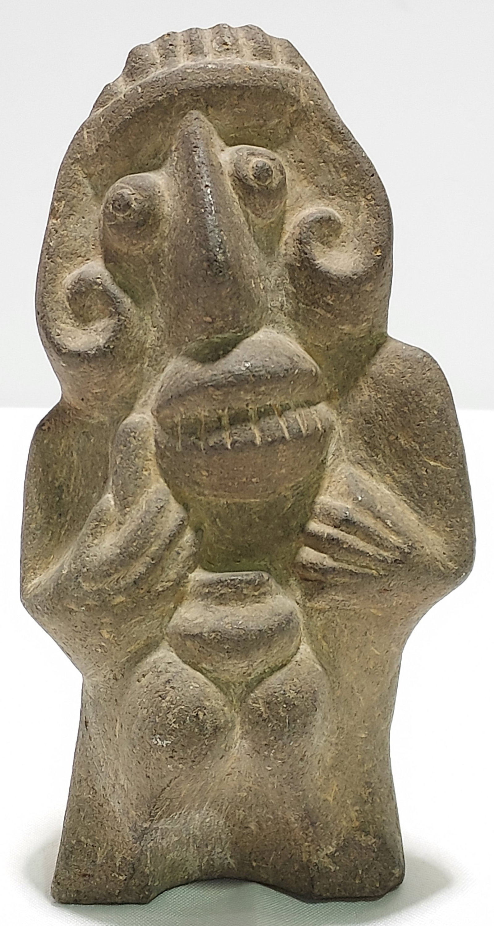 PRE-COLUMBIAN STYLE CARVED STONE FIGURE: Pre-Columbian style carved stone figure. Appears to depict a woman holding a pot on her knees. Measures 7.75" tall x 4" wide. Condition: normal expected signs of age, losses to feet, see images. Weigh