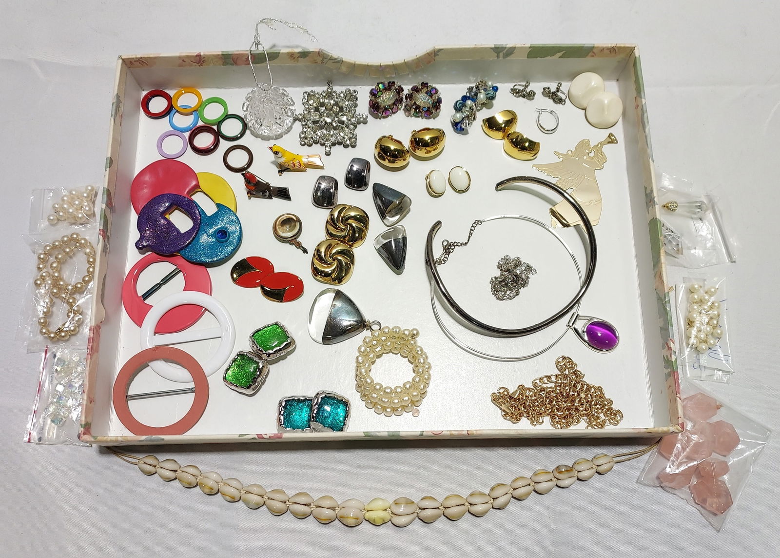 COSTUME AND SILVER JEWELRY LOT SIGNED AND UNSIGNED: Estate lot assorted costume and sterling jewelry including a pair of Hobe clip on iridescent oval beaded glass earrings, a pair of Vendome clip on blue, pearl, and clear beaded earrings; a pair of St.