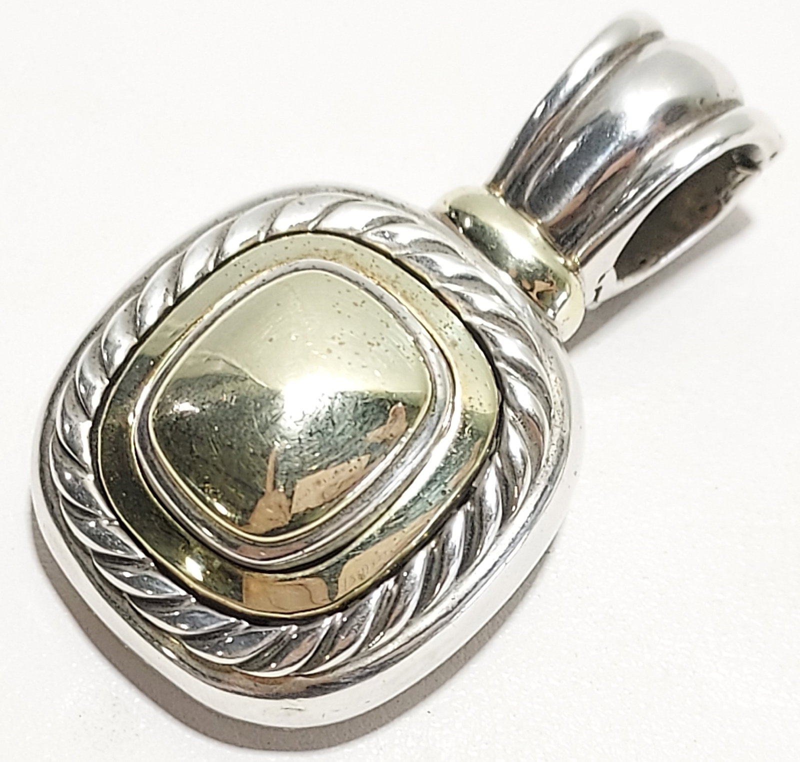 DAVID YURMAN 14K GOLD & 925 LARGE ALBION ENHANCER: David Yurman 14k gold and 925 large Albion enhancer: 14k yellow gold and sterling silver enhancer. Large size. Condition is good and only shows expected signs of use. Please see images. Approx. dimens