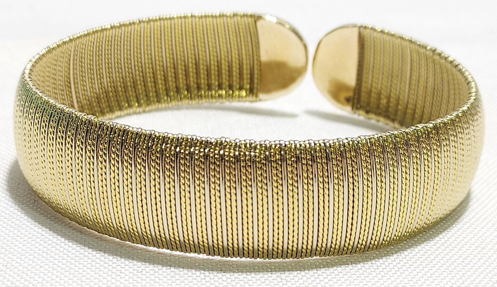 VINTAGE 18K YELLOW GOLD CHIMENTO BRACELET: Vintage 18k yellow gold Chimento bracelet: ribbed, flexible 18k yellow gold bracelet by Chimento. Stamped on inside with makers mark and 750. Condition is good with minor signs of use and some minor m