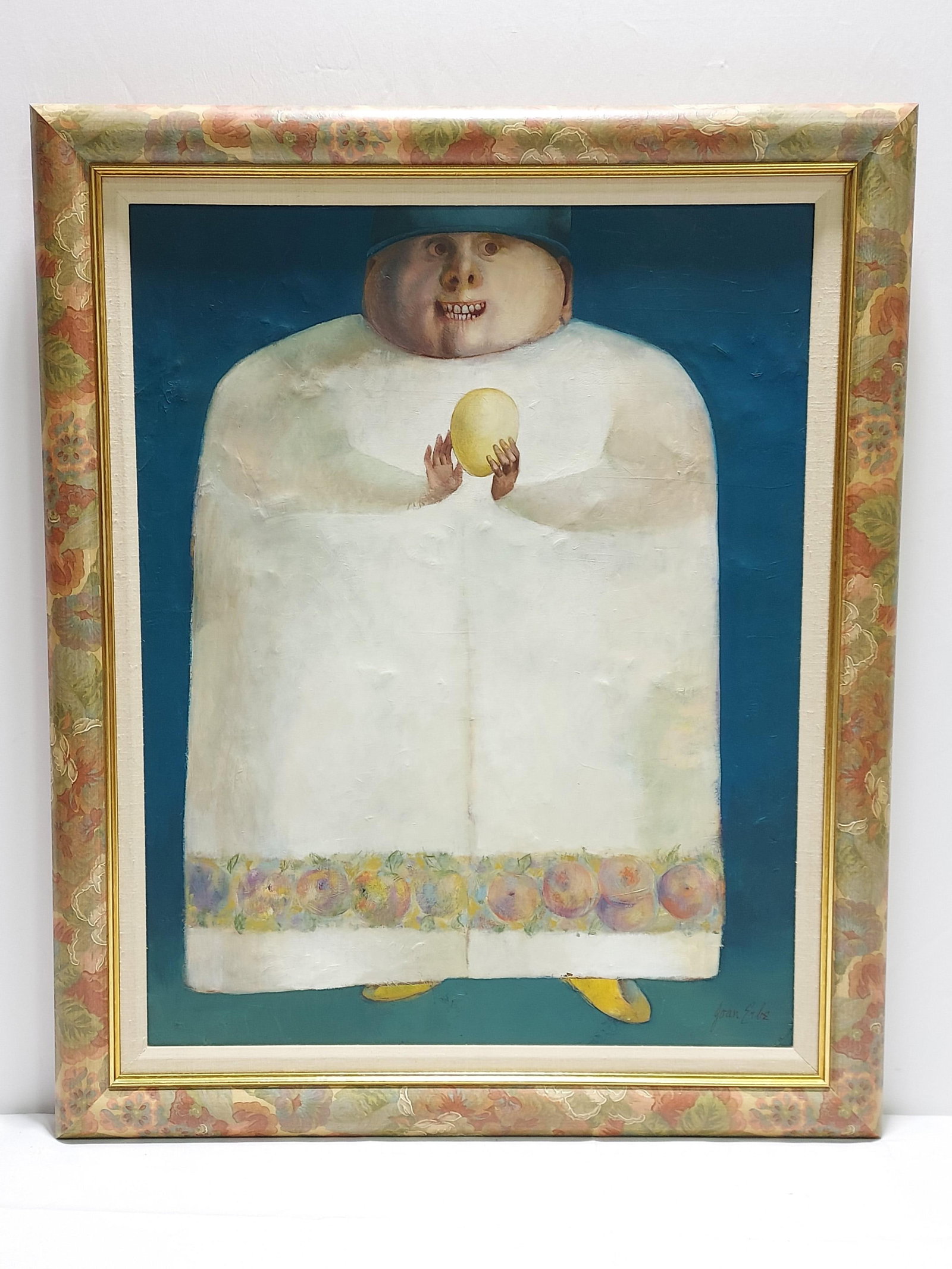 JOAN ERBE OIL ON CANVAS PAINTING: MAN WITH EGG: Joan Erbe oil on canvas painting of Man With Egg: framed in a floral painted wood frame with a linen color mat. Signed by artist lower right. Condition shows some minor signs of age and handling, incl