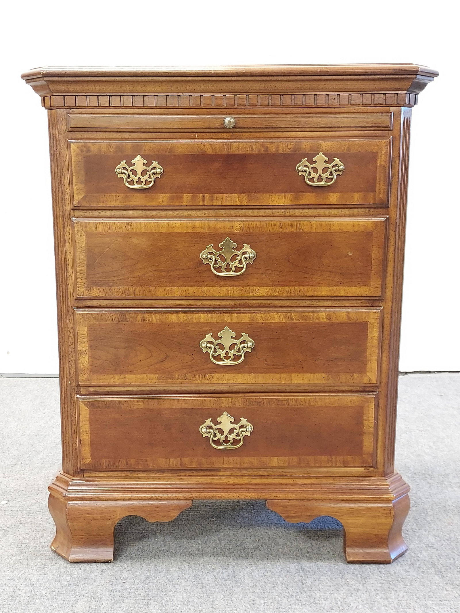 CHIPPENDALE STYLE PARQUETRY INLAID MAHOGANY CHEST: Chippendale style parquetry inlaid mahogany chest with four drawers and a pull-out writing surface. Measures a total of 33" tall x 26" wide and 16" deep. Condition: minor signs of normal use and age t