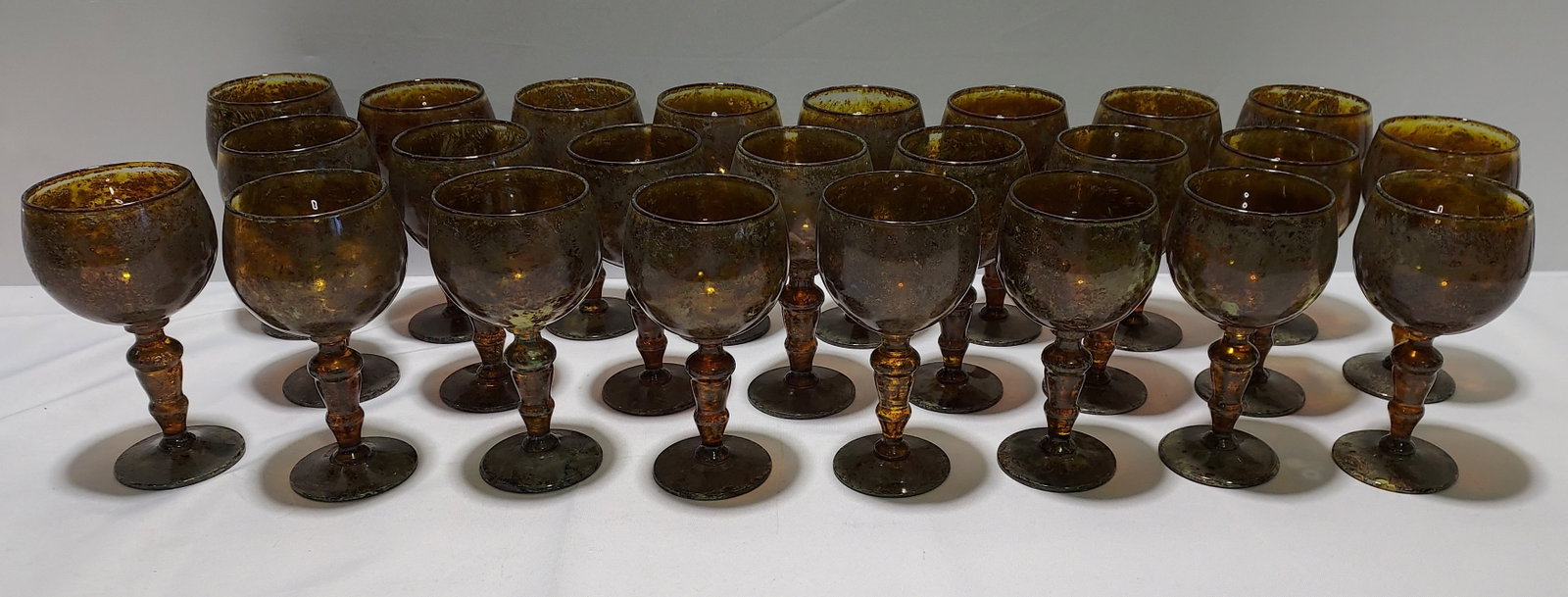 H148 24 Neiman Marcus Moss Agate Wine stems: 24 Neiman Marcus Moss Agate Wine stems with balloon style cups. 8" x 4.25".