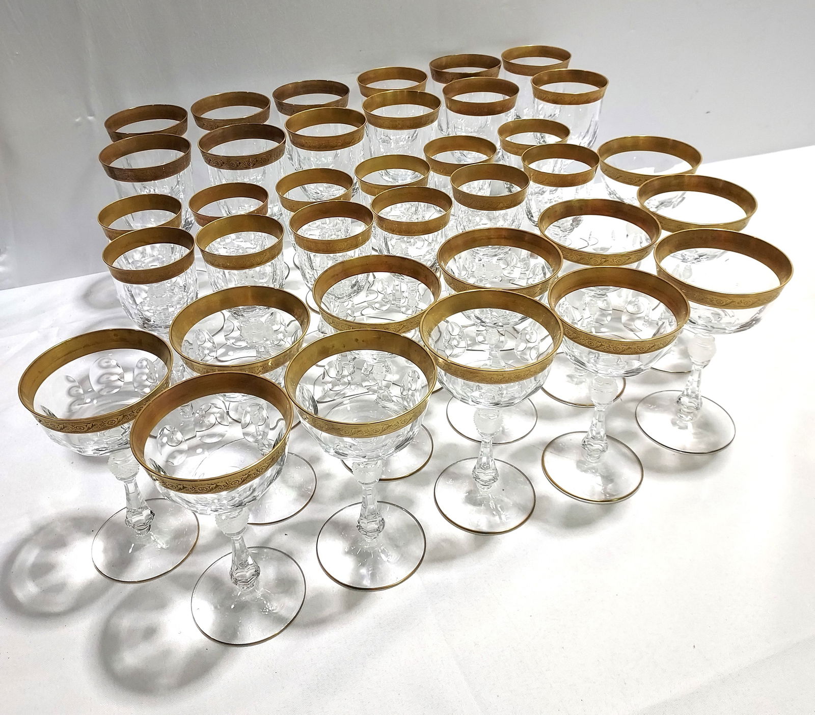 H300 Theresienthal 'Jessie' Crystal Gold Stemware: Theresienthal (Bavaria) crystal wine stem service for 12 with 3 pieces per service. 36 pc. Includes wine stems 8.25 x 3.25", sherry stems 7" x 2.75", and champagne coupes 6.5" x 4" in Theresienthal's