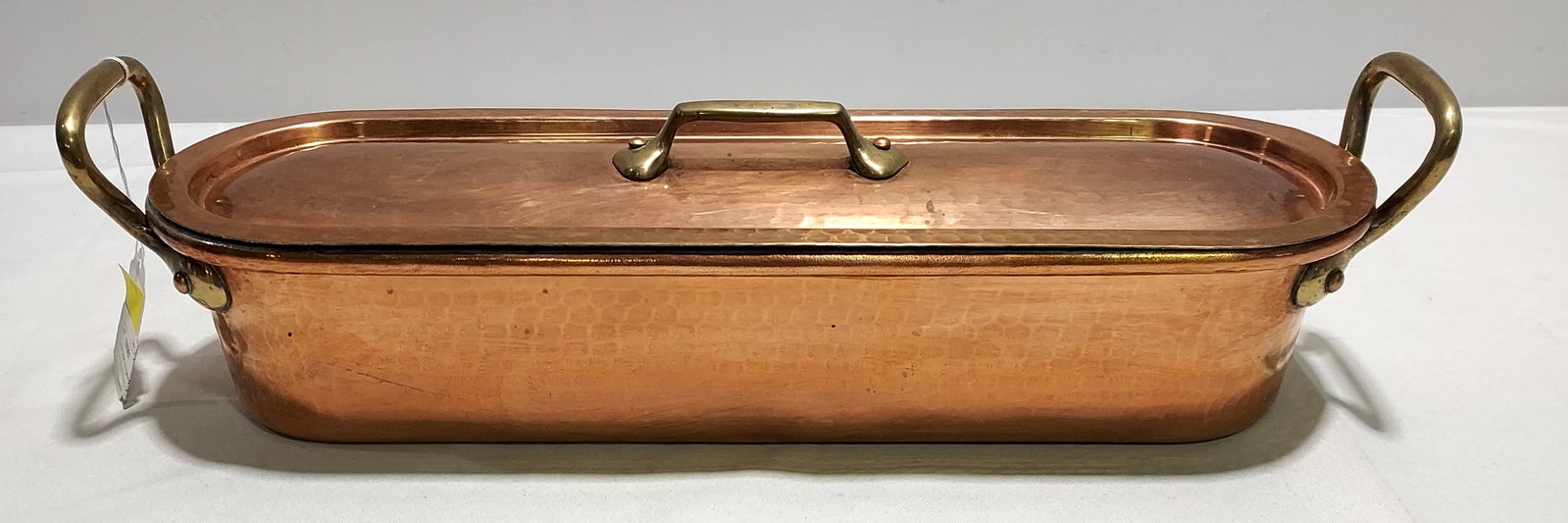 H154 Copper Fish Poacher by Dehillerin: Dehillerin hammered copper fish poacher with lid, brass handles, tin lining, and fish lifting accessory. 6" x 22" x 6.5"