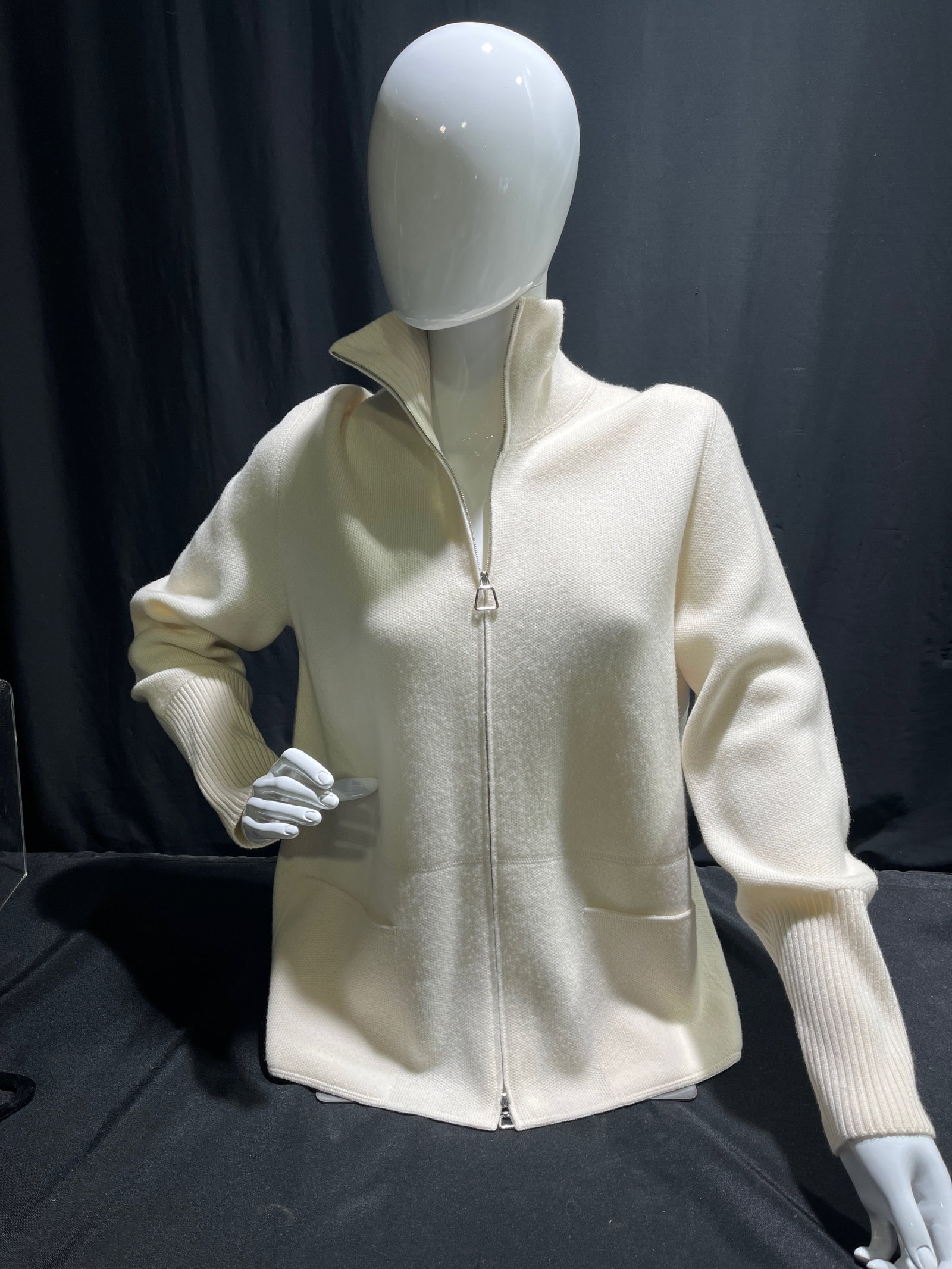 H882 Akris cream colored cashmere zip up cardigan: Akris cream colored cashmere zip up cardigan, with high collar, ribbed cuffs, and two front pockets. Label still attached. Retail $2990 , Size 12