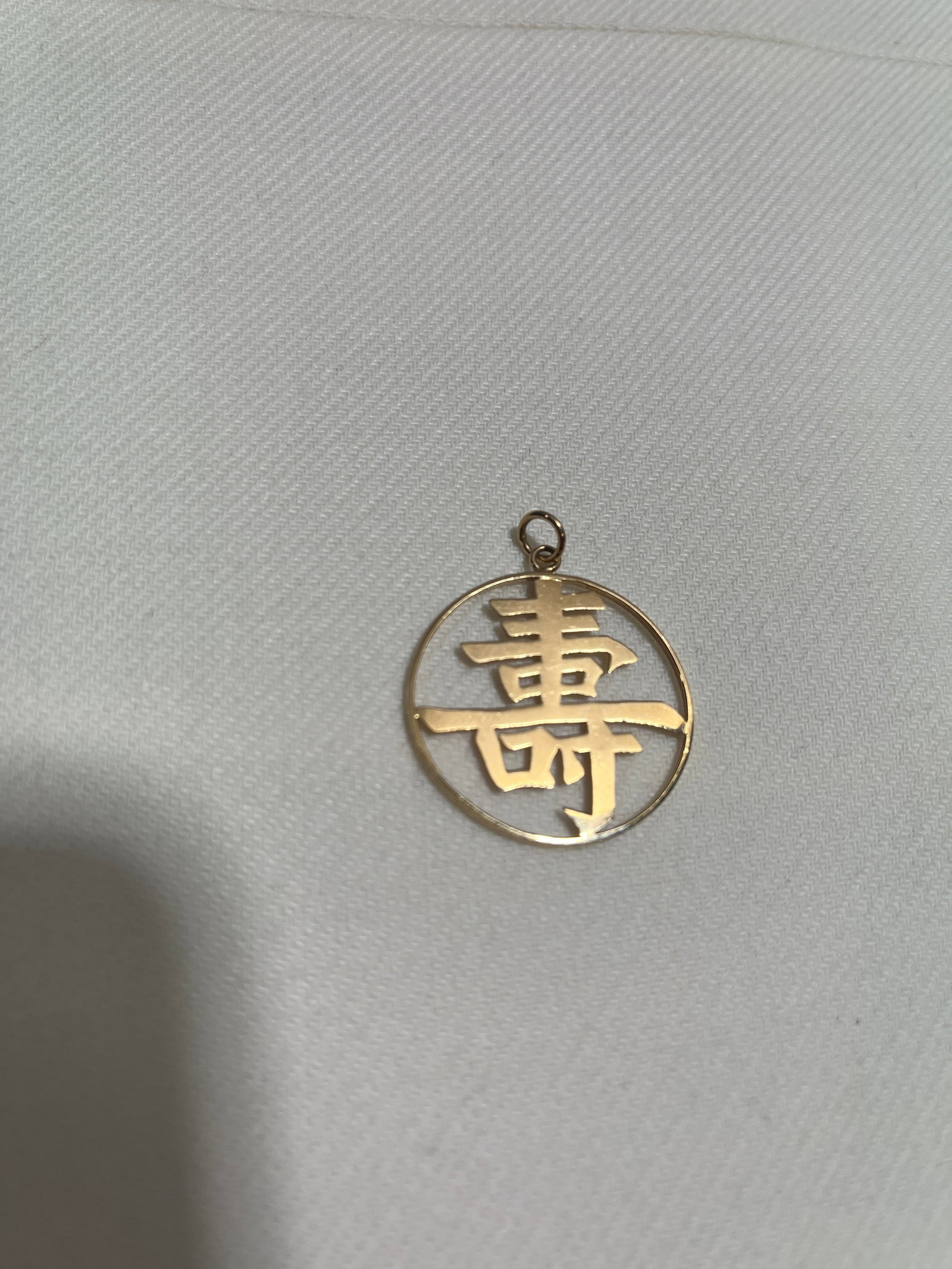 HJ109 14k yellow gold Chinese charm: 14k yellow gold Chinese charm. Approx. dimensions: Approx. 1.4" tall including bail and jump ring. 1.9 DWTS