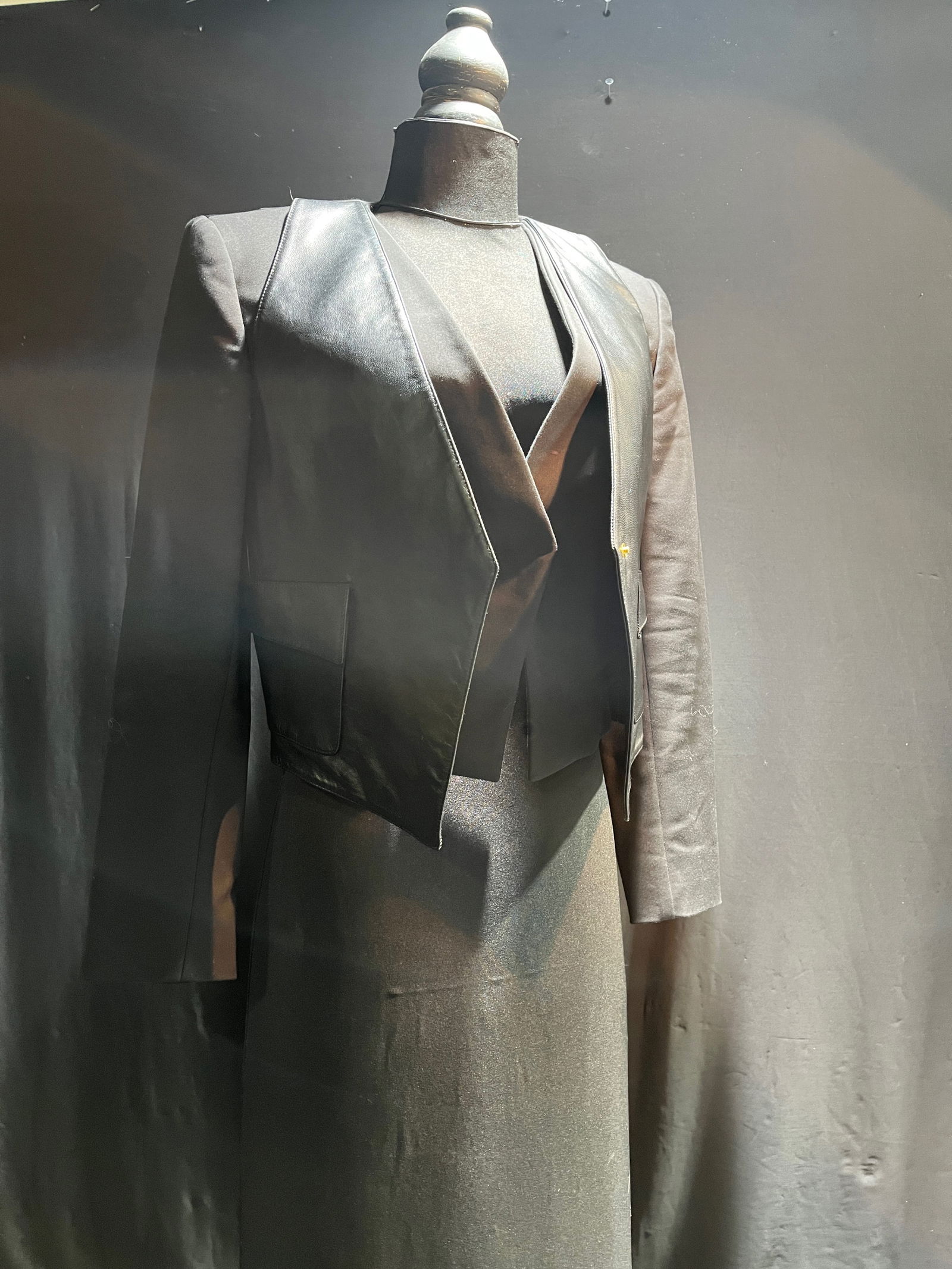 H1190 Versace Jacket: Versace Jacket: short jacket with black overlay; overlay has two flap front pockets and angled front. Size 40