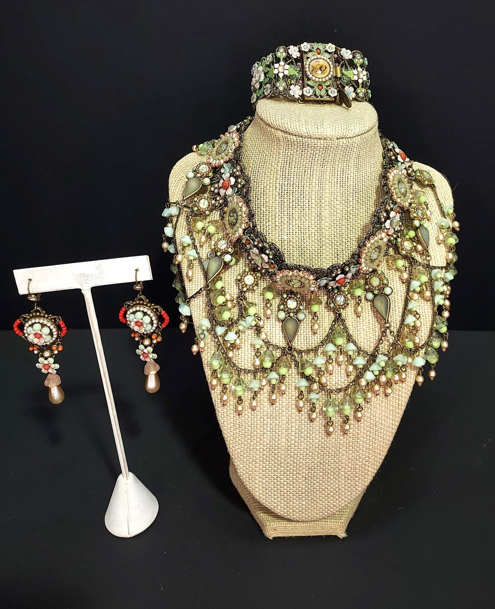 H502 Michal Negrin necklace, bracelet and earrings: Michal Negrin necklace, bracelet and earrings set. Necklace measures 14" long, bracelet 7", and earrings each 3" long. Signs of wear and age.