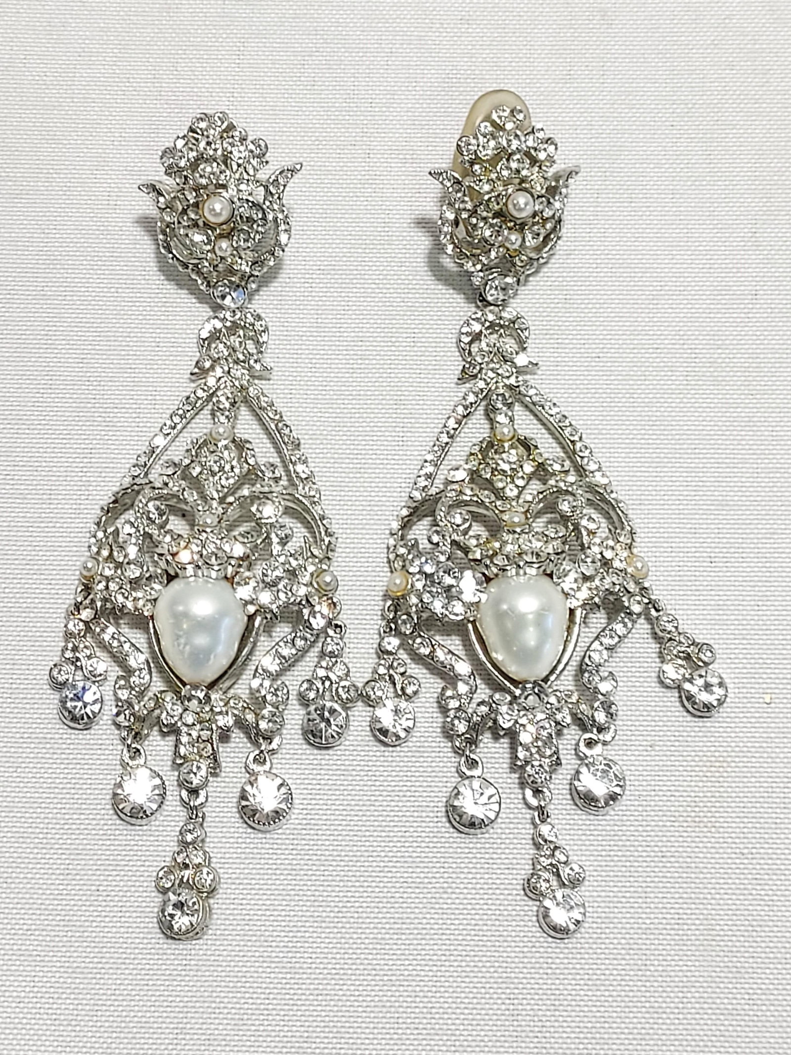 H608 Barrera silver metal crystal & pearl earrings: Barrera silver tone metal, crystal, and pearl chandelier clip-on earrings