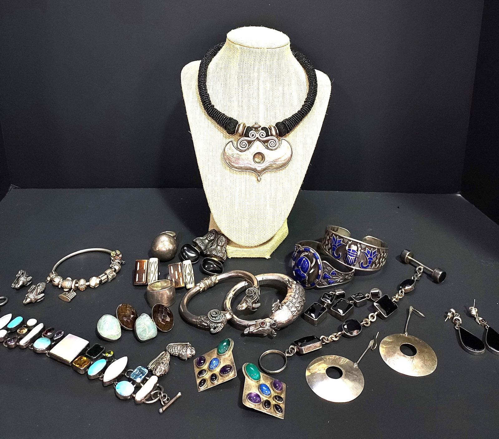 H525 Signed & unsigned sterling silver jewelry: Signed and unsigned sterling silver jewelry: unsigned cobalt enamel scarab cuff bracelet, unsigned cobalt enamel scarab cuff bracelet, pair of signed Rebecca Collins clip on faux bone earrings, a pair