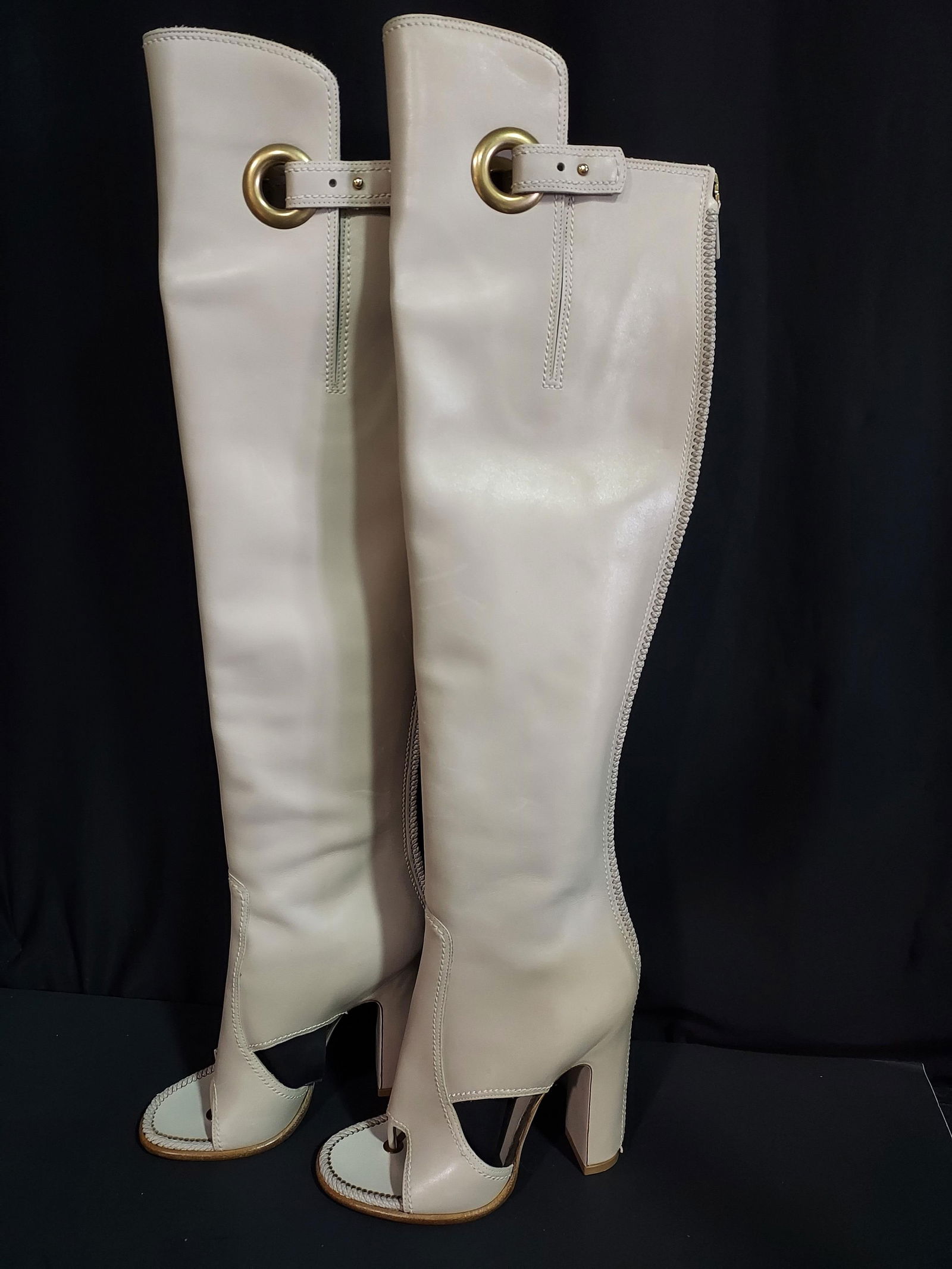 H766 Ferragamo open toe boots: Ferragamo open toe boots. Knee high light stone color leather boots with open toe, cut outs at instep, round toe, zipper at back, small side slits at top with small strap and buckle. Unworn. Size 5.5