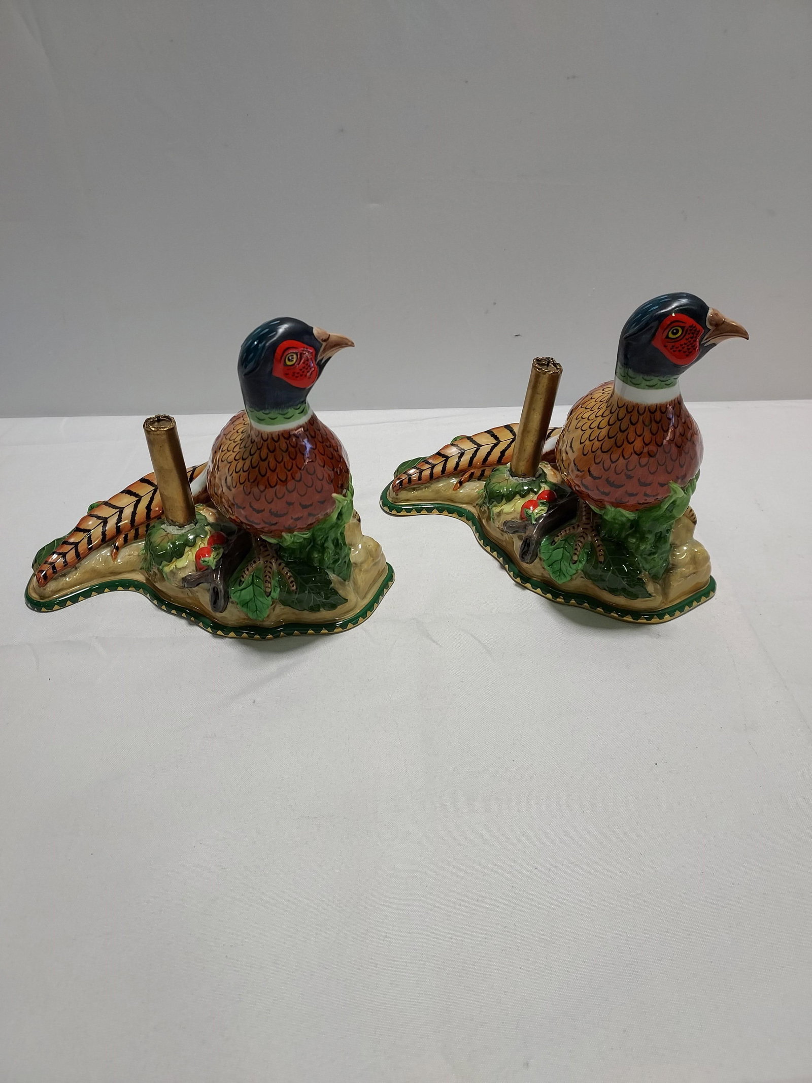 H941 A pair of Lynn Chase pheasant candle holders: A pair of Lynn Chase pheasant candle holders from the "Winter Game Birds" series. 9" x 12" x 5.5" 3rd quarter 20th C