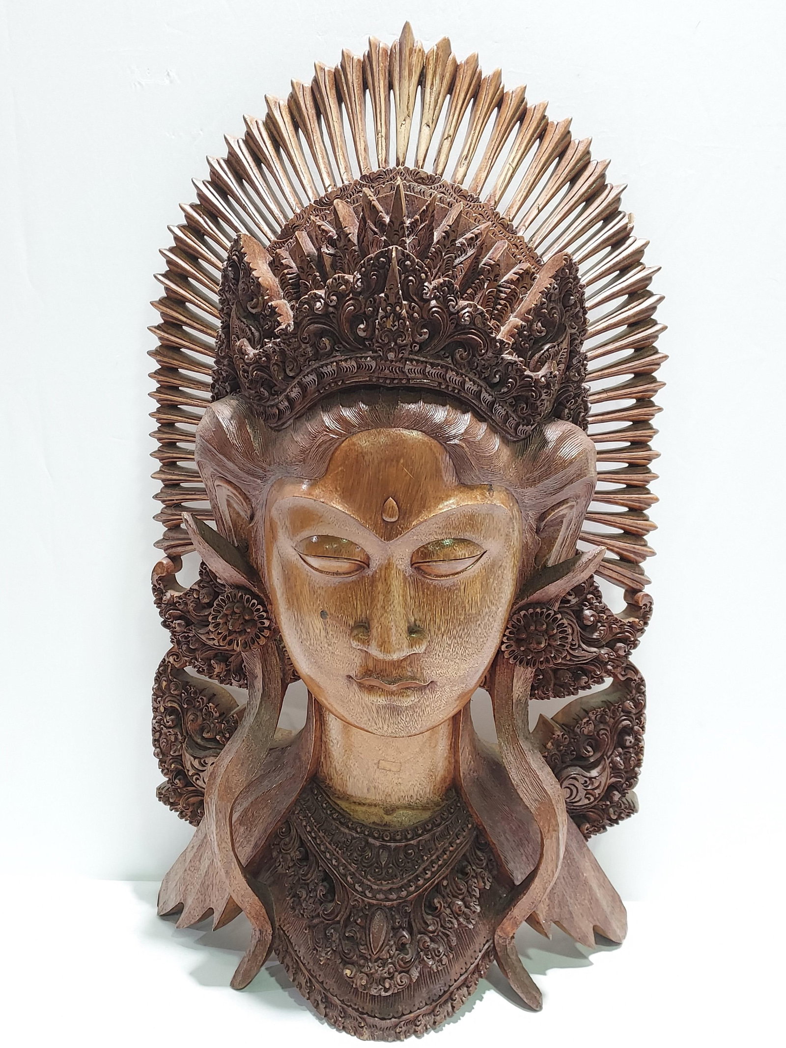 H1088 Ebonized carved wood Balinese female mask: Ebonized carved wood Balinese female mask. 4th quarter 20th C. 21" x 13" x 6"