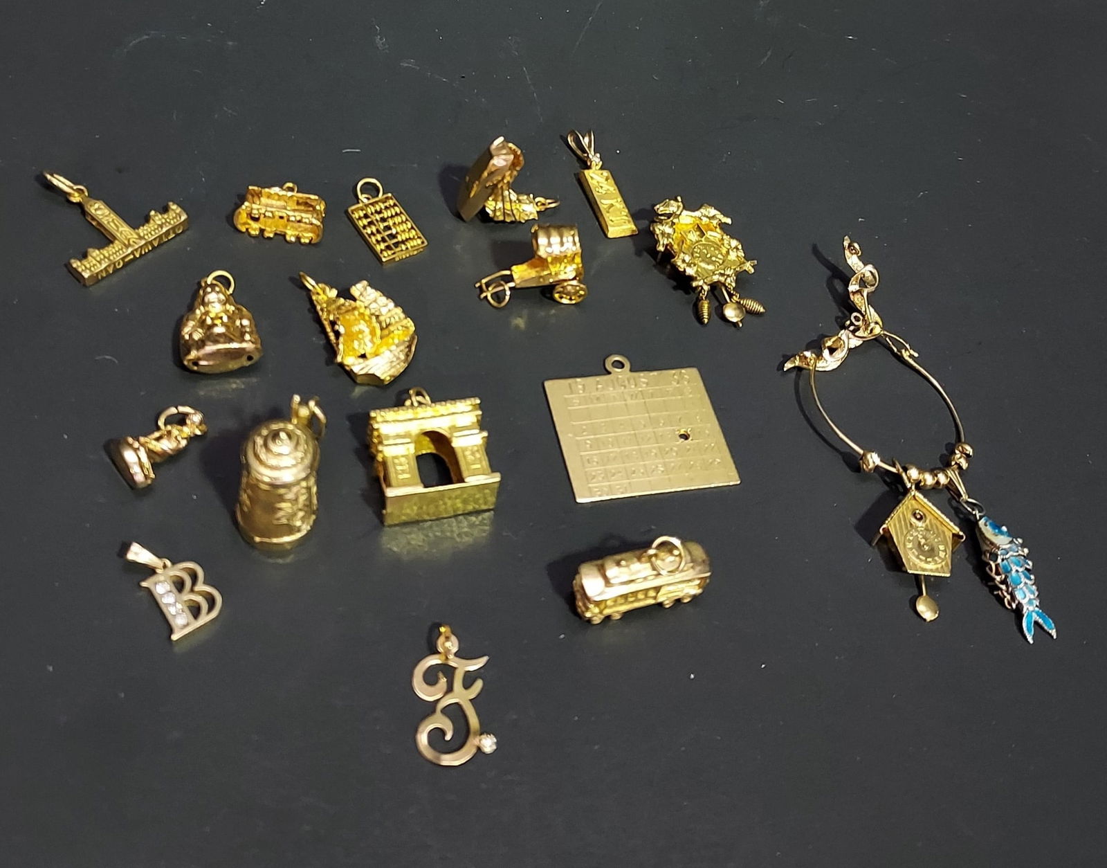 HJ111 Lot of 17 assorted yellow gold charms (1 of 10)