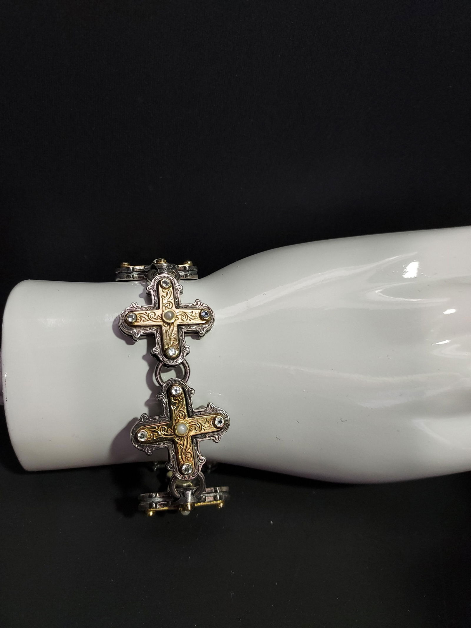 HJ122 Silver and yellow gold crosses bracelet: Silver and yellow gold crosses bracelet: 6 crosses which have yellow gold inlay, white stones and seed pearls. 43.7 DWTS