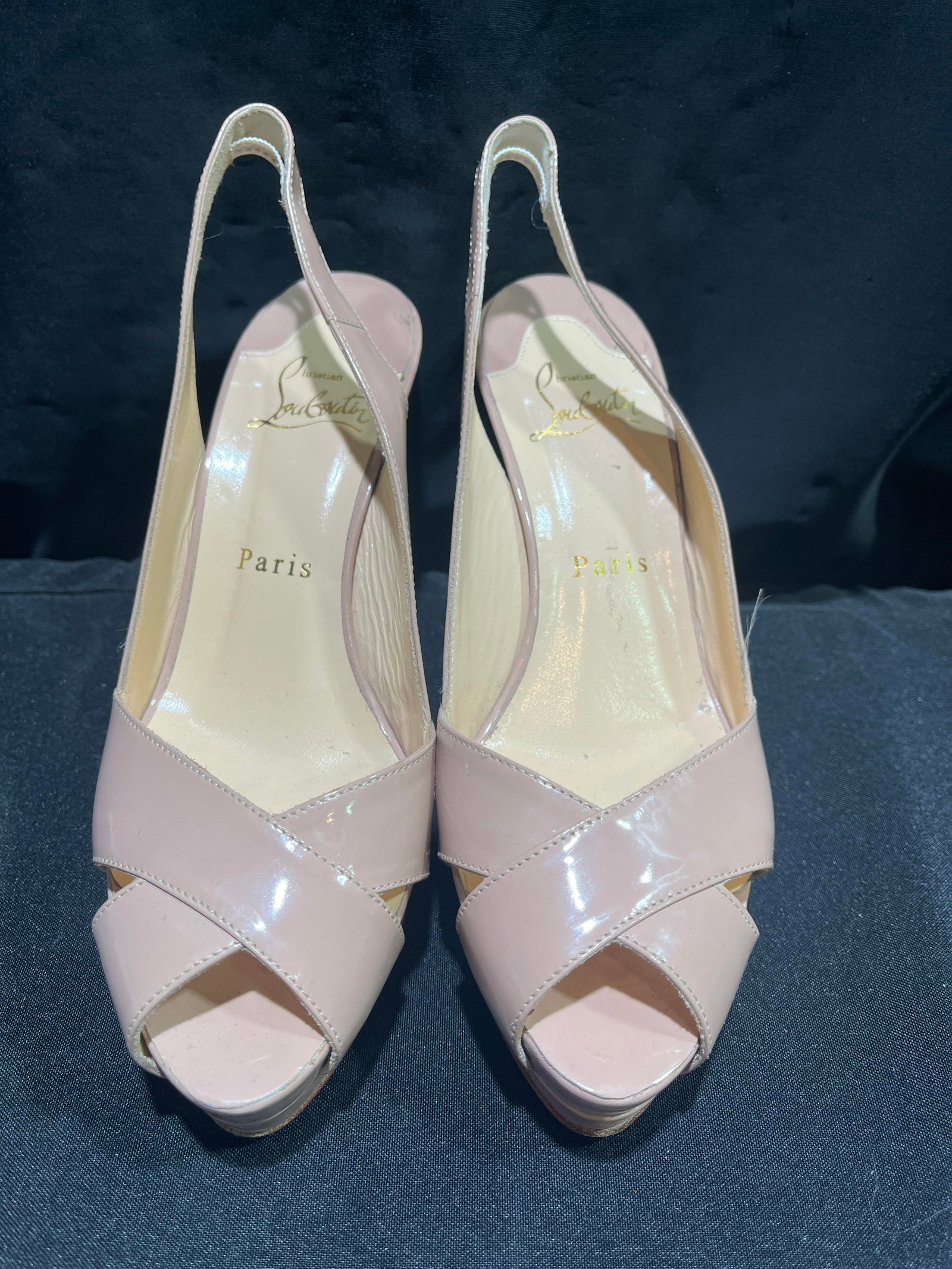 H1171 Christian Louboutin nude patent leather pump: Christian Louboutin nude patent leather slingback heels. Moderate wear. Size 36