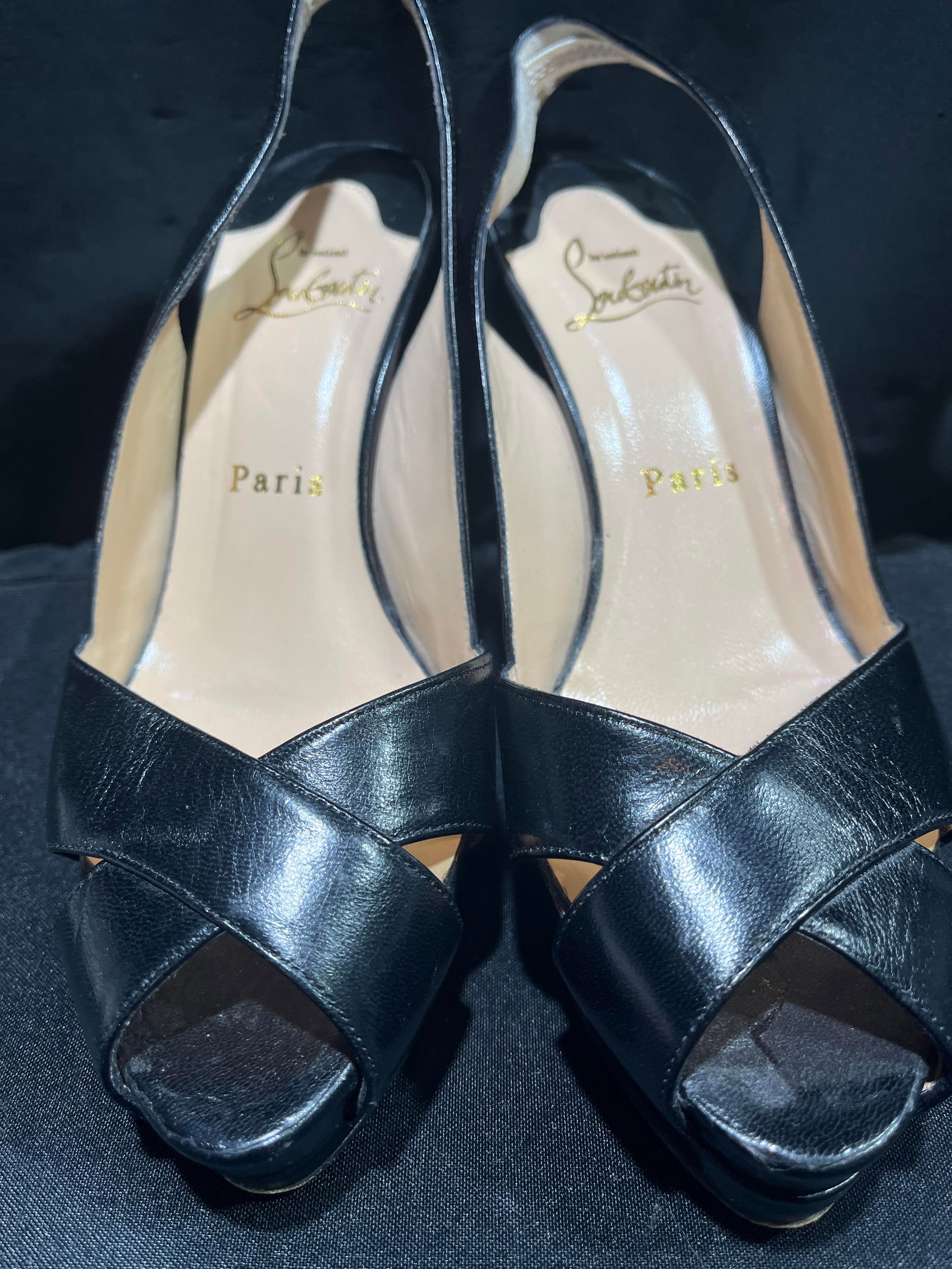 H1171 Christian Louboutin black leather slingbacks: Christian Louboutin black leather slingback sandals. Moderate wear. Size 35.5