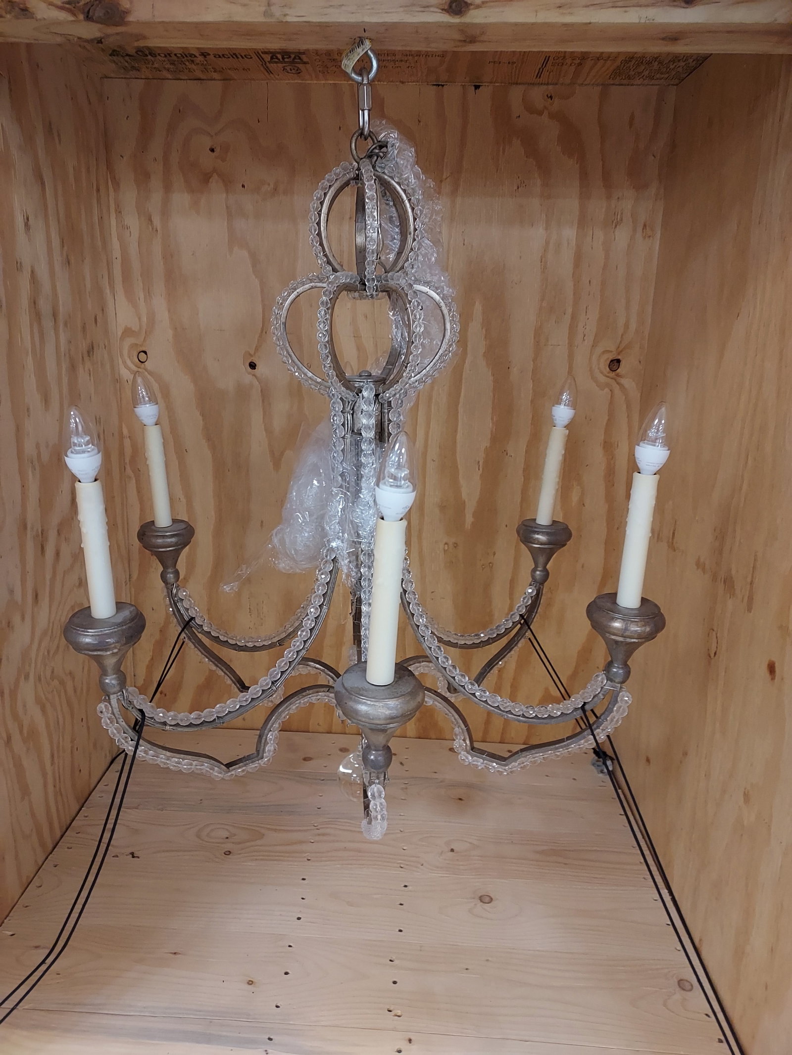 H1288 6 arm chandelier with polished clear crystal: Chandelier: white metal, electrified, 6-arm candle light, chandelier entirely lined with small, round, polished clear crystal beads. Exposed wiring. 36" x 28". 4th quarter 20th C.