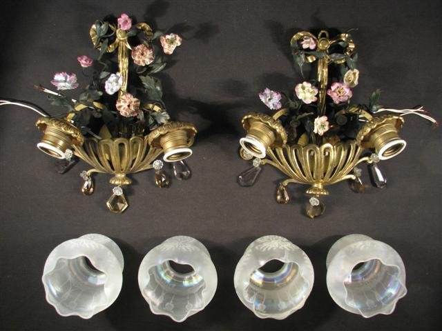 PAIR BOLER FRENCH TWO LIGHT FLORAL WALL SCONCES: Pair of French two light wall sconces by Boler. Each sconce is decorated with wire foliage, porcelain flowers and various cut crystal hanging prisms. Shades are hand blown frosty iridescent glass with