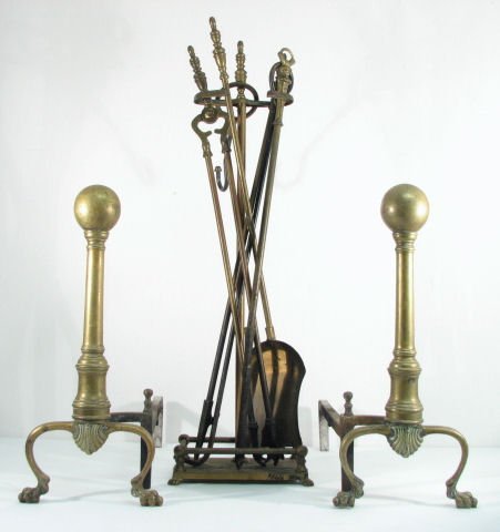 19TH C. BRASS FIREPLACE ANDIRONS & TOOLS: 8 PCS: 19th century brass fireplace andirons and assorted tools. Lot includes a shovel/scoop, two pokers, a hook, tongs, tool stand and two andirons. Not all tools are matching. Condition: heavy wear to bras