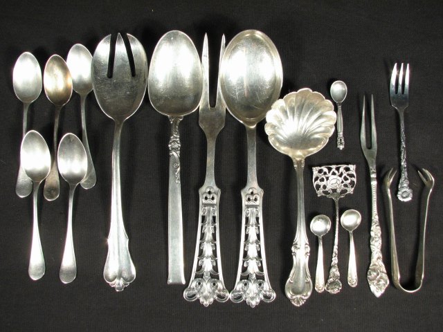 STERLING SILVER UTENSILS: GEORG JENSEN, ETC. 15.4 TROY : Lot of assorted silver utensils. Includes a pierced "Norway Sterling" silver serving spoon and fork, a sterling rose pattern two tine fork, an "Heirloom Sterling" "Silver Rose" 8.25" spoon, a 8.5" spo