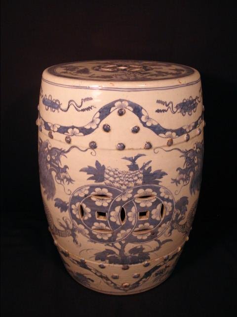 CHINESE BLUE & WHITE GLAZED STONEWARE GARDEN SEAT: Early Chinese blue and white stoneware garden seat. Circa early 19th century, with a blue and white dragon motif, pierced sides, and pierced top. Condition: minor glaze skips and knicks, see images fo
