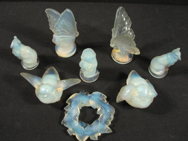 EIGHT SABINO OPALINE ART GLASS MINIATURES: Lot of eight Sabino opaline art glass miniatures. Includes a swallow with wings down, a swallow with wings spread, two butterflies, a cat, a dog, a figure of a putti, and a small swallow wreath. All p