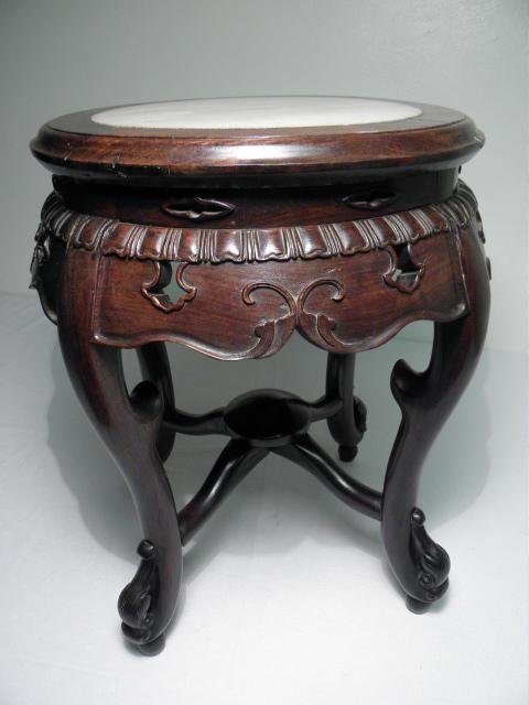 EARLY 20TH C CHINESE CARVED WOOD & MARBLE PEDESTAL STAN: A 20th century Chinese carved wood plant stand/ pedestal table with an inset marble top. Early wooden construction on frame. Condition: some minor splits to wood, see images. Measures 18" tall x 16" w
