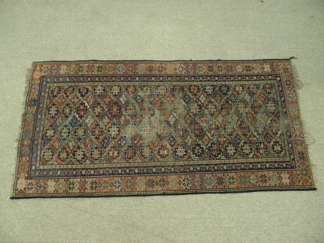 TURKISH GEOMETRIC PATTERN THROW RUG - 5' 8" x 2' 10": Turkish wool throw rug with a geometric pattern. Hand knotted with colors of blue, red, pink, black, white, etc. Condition: minor fraying at edges, some discoloration from age and wear to pile, see im