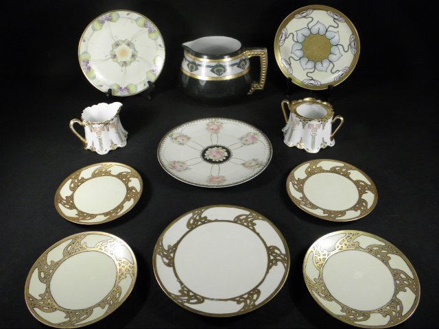 ASSORTED ARTS & CRAFTS STYLE PORCELAIN: 11 PCS: Lot of assorted arts and crafts style porcelain ware. Includes eleven pieces total: a 5.25" tall Bavarian porcelain handled coffee pot (signed and dated "M. Brown, Dec. 1911"), a Marie Brown hand pain